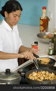 Maid preparing food in the kitchen