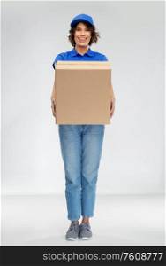 mail service and shipment concept - happy smiling delivery woman with parcel box over grey background. happy smiling delivery woman with parcel box