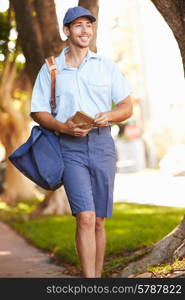 Mailman Walking Along Street Delivering Letters