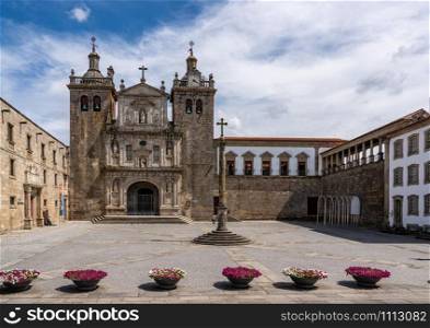 Main cathedral or Se in Viseu with stone cross and large empty square. The main square of Viseu by the cathedral in the Old Town