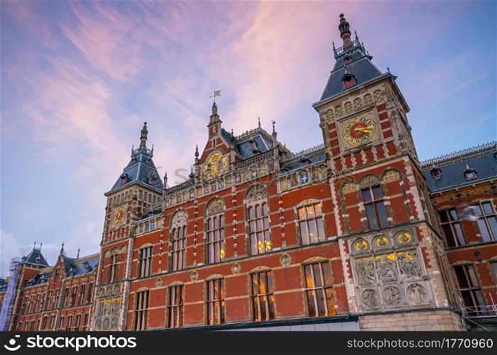 Main train Station in Amsterdam, Netherlands at sunset