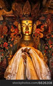 Maitreya Buddha statue close up Tibetan monastery Thiksey Gompa. Ladakh, Jammu and Kashmir, India. Maitreya Buddha statue