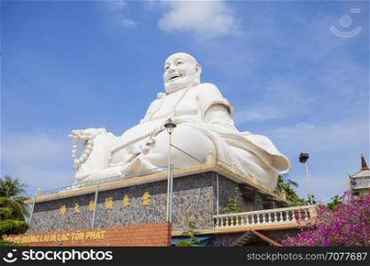 Maitreya Buddha statue located in the famous Vinh Trang pagoda in My Tho city, Tien Giang province, Vietnam.