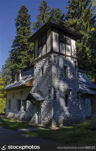 Majestic ancient building of Hydroelectric plant in the old park Tsarska or Royal Bistritsa near by resort Borovets, Rila mountain, Bulgaria