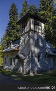 Majestic ancient building of Hydroelectric plant in the old park Tsarska or Royal Bistritsa near by resort Borovets, Rila mountain, Bulgaria