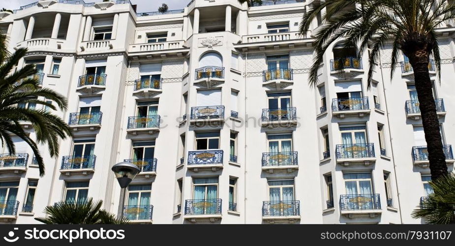 Majestic building with elegant art deco style windows and balconies on the sea front Boulevard de la Croisette in Cannes, Cote d?Azur, France.