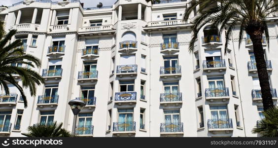 Majestic building with elegant art deco style windows and balconies on the sea front Boulevard de la Croisette in Cannes, Cote d?Azur, France.