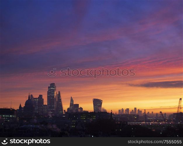 Majestic dawn sunrise landscape cityscape over London city sykline looking East along River Thames