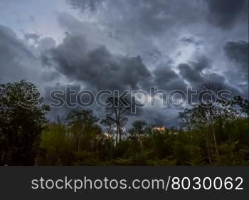 Majestic mountains landscape under morning sky with storm clouds