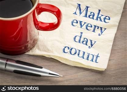 Make every day count - inspirational handwriting on a napkin with a cup of coffee