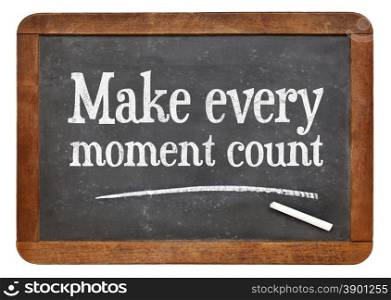 Make every moment count - white chalk text on a vintage slate blackboard
