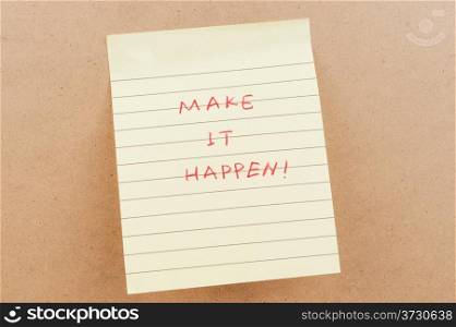 Make it happen words written on a sticky note