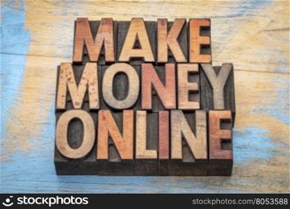 make money online phrase in vintage wood letterpress type blocks, stained by color inks
