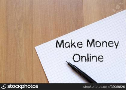 Make money online text concept write on notebook with pen