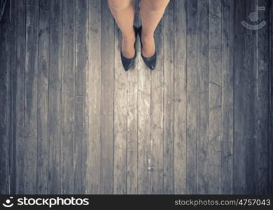 Make next step. Top view of businesswoman legs in elegant shoes