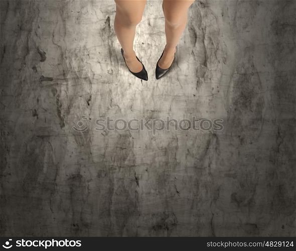 Make next step. Top view of businesswoman legs in elegant shoes