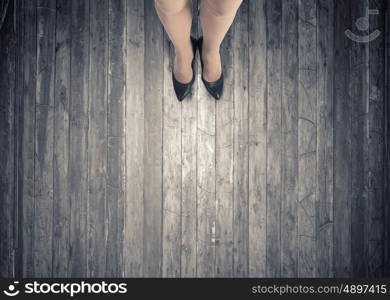 Make next step. Top view of businesswoman legs in elegant shoes