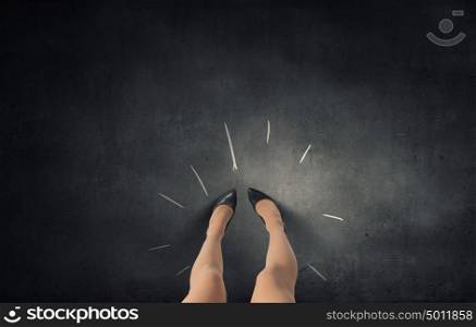 Make next step. Top view of businesswoman legs in elegant shoes