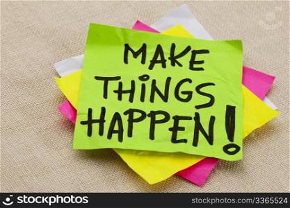 Make things happen motivational reminder - handwriting on a green sticky note
