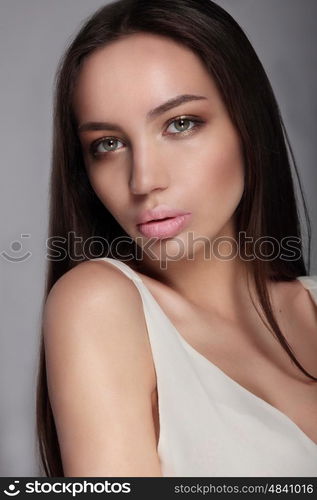 Make-up &amp; cosmetics. Portrait of beautiful woman model face with clean skin, full glossy lips.