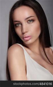 Make-up &amp; cosmetics. Portrait of beautiful woman model face with clean skin, full glossy lips.