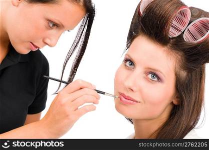 Make-up artist beautiful woman fashion model apply lipstick