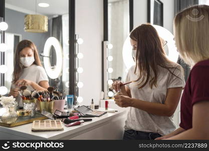 make up artist wearing medical mask