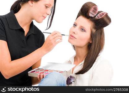 Make-up artist woman fashion model apply lipstick from color palette