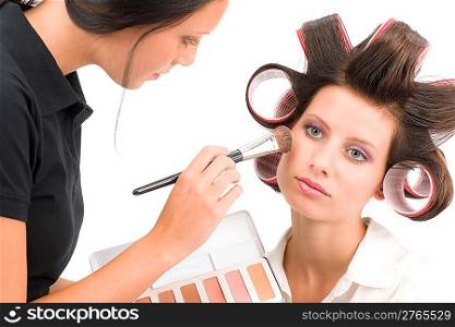 Make-up artist woman fashion model apply powder blush rouge brush