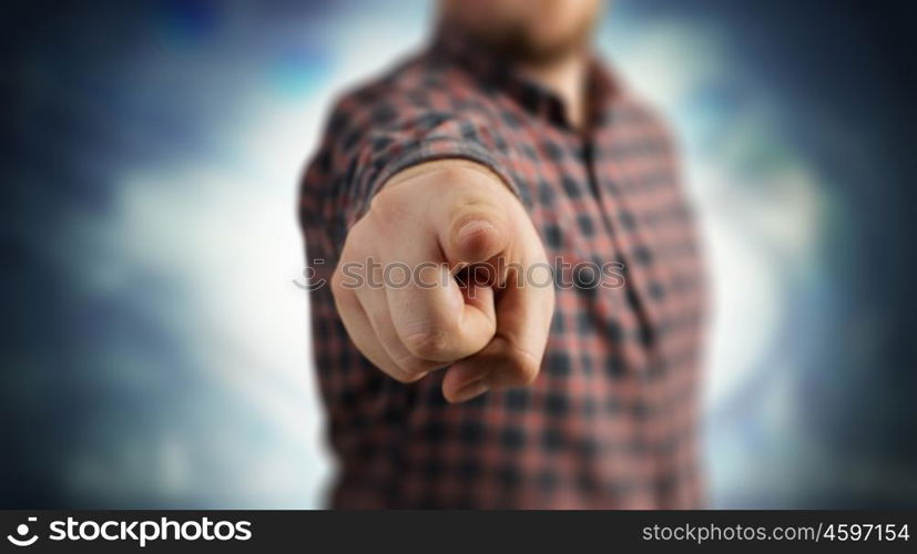 Make your choice. Close view of man in casual pointing with finger to camera