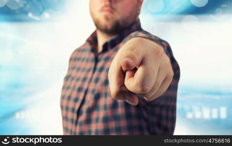 Make your choice. Close view of man in casual pointing with finger to camera