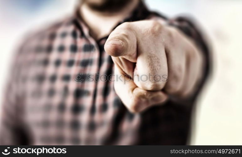 Make your choice. Close view of man in casual pointing with finger to camera