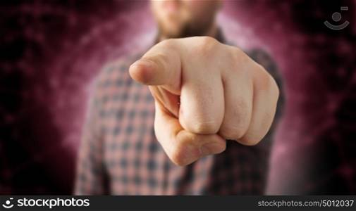 Make your choice. Close view of man in casual pointing with finger to camera