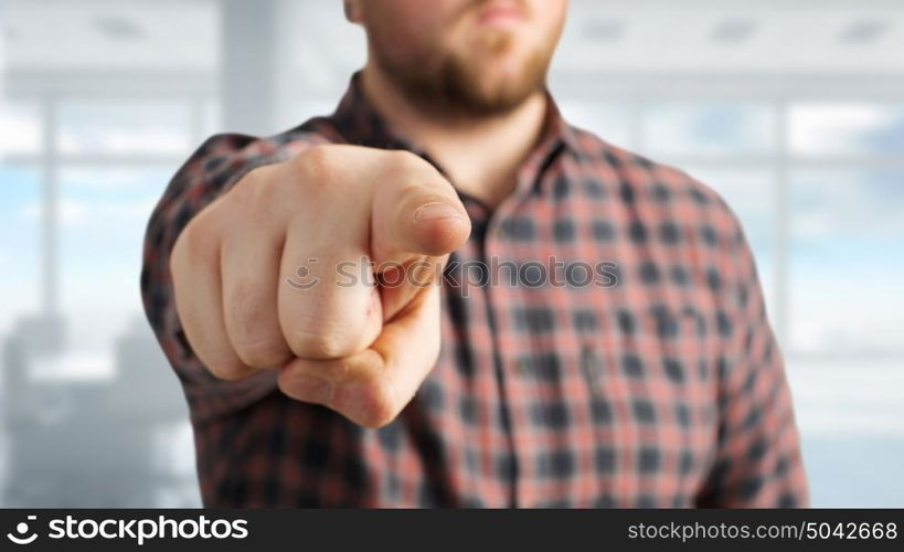 Make your choice. Close view of man in casual pointing with finger to camera