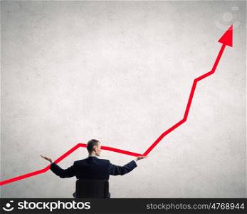 Make your income grow. Back view of businessman hold growth arrow graph