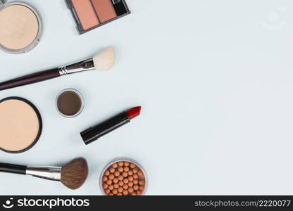 makeup accessories arrangement light background