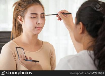 Makeup artist applying eyeshadow