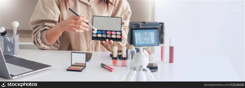 Makeup Beauty fashion blogger recording video presenting cosmetics at home influencer on social media concept