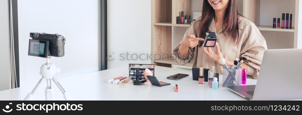Makeup Beauty fashion blogger recording video presenting cosmetics at home influencer on social media concept