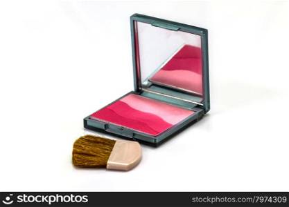 makeup brush and cosmetics on a white background