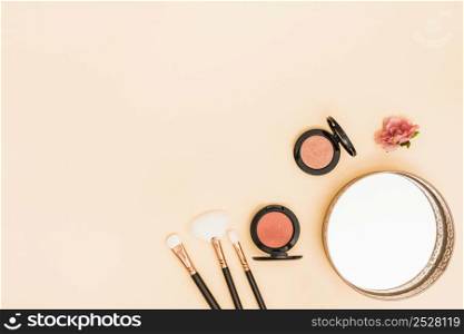 makeup brushes compact face powder rose mirror corner colored backdrop