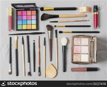 Makeup cosmetics brushes and accessories on white background. To. Makeup cosmetics brushes and accessories on white background. Top view. Flat lay. beauty concept.