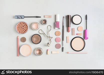 makeup products arranged rectangular shape white backdrop. High resolution photo. makeup products arranged rectangular shape white backdrop. High quality photo
