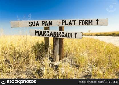 Makgadikgadi Pan sign in Botswana, Africa pointing to the huge salt flats of the Makgadikgadi Pan