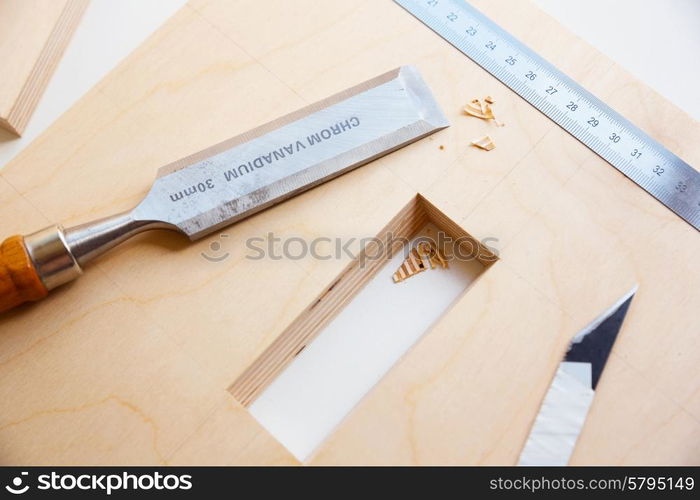 Making a component of wood furniture. Close-up photo