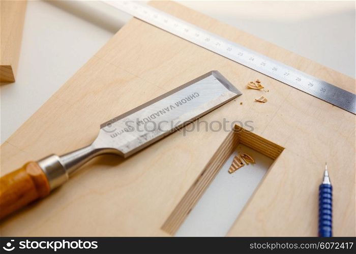 Making a component of wood furniture. Close-up photo