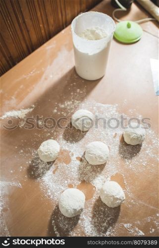 Making bread in a kitchen. Balls of dough