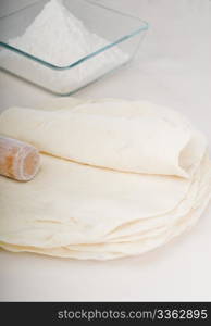 making fresh homemade pita bread ,with ingredients overa table