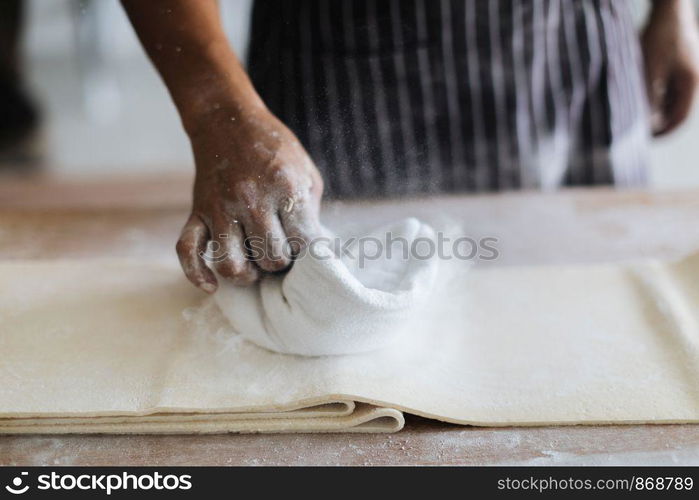 Making Handmade Noodles on wood background