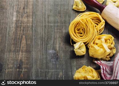Making homemade pasta on wooden table